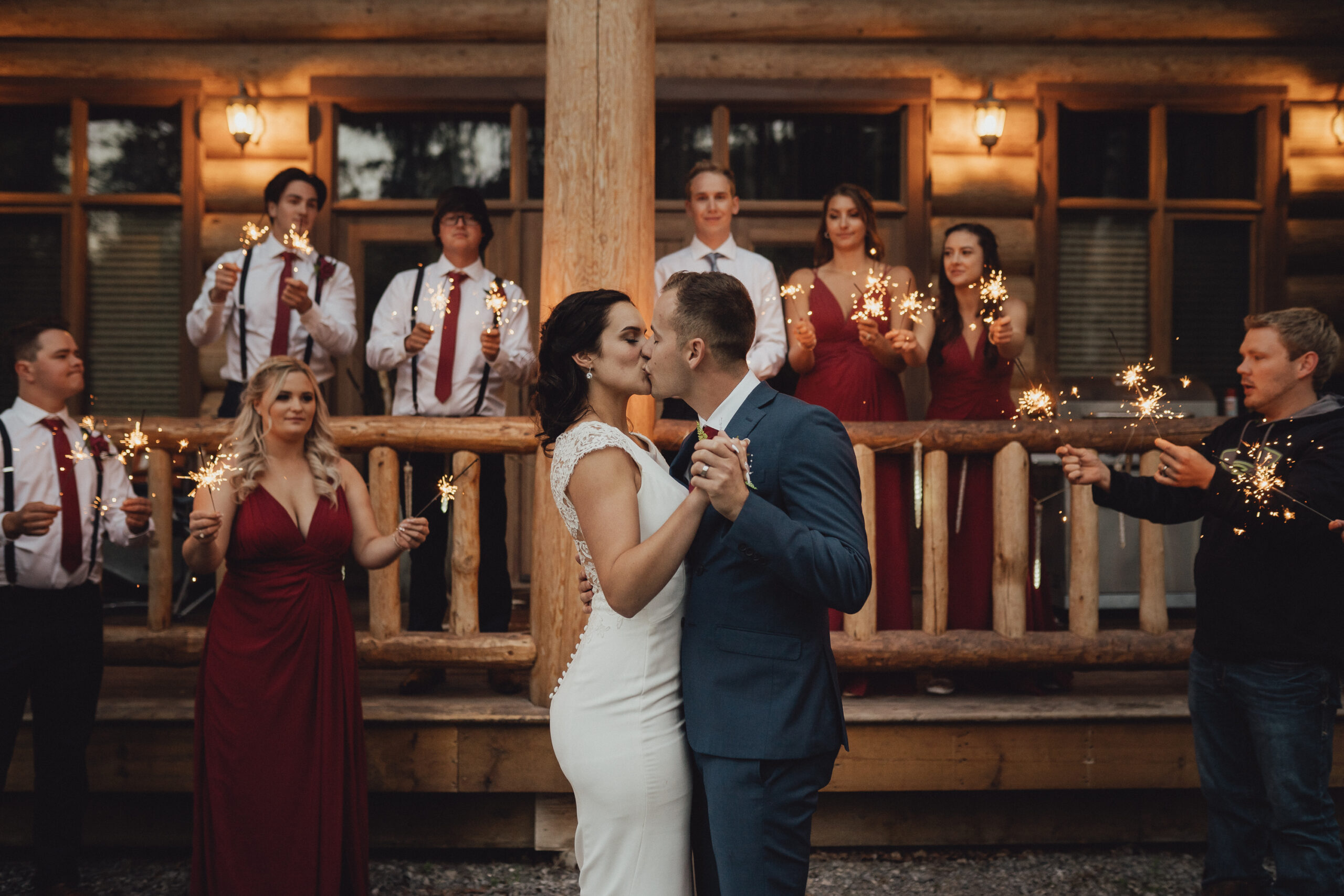 Bride and groom having first dance in luxury log cabin