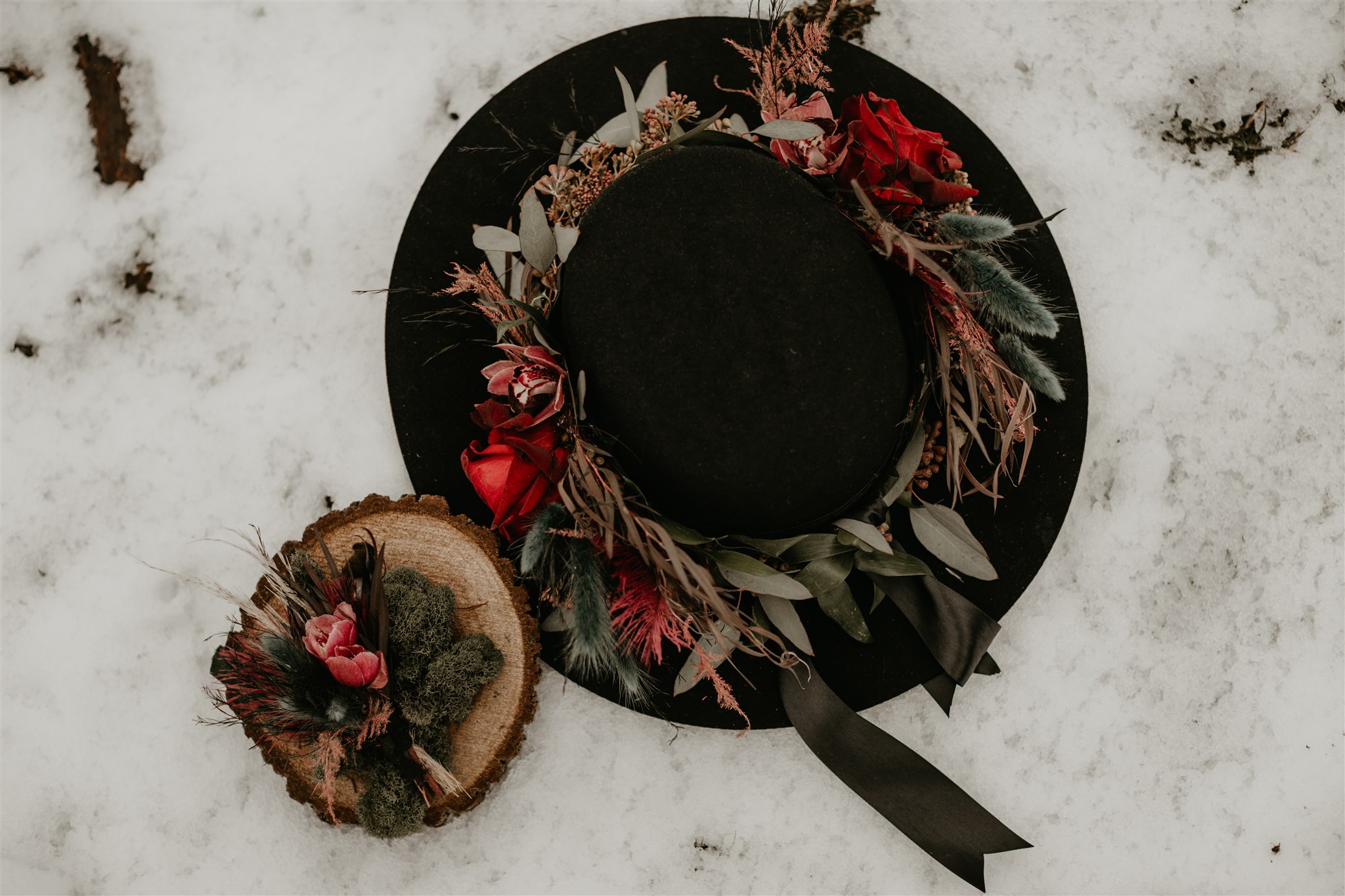 Black Wedding Hat with Sage and Red Garland on snow