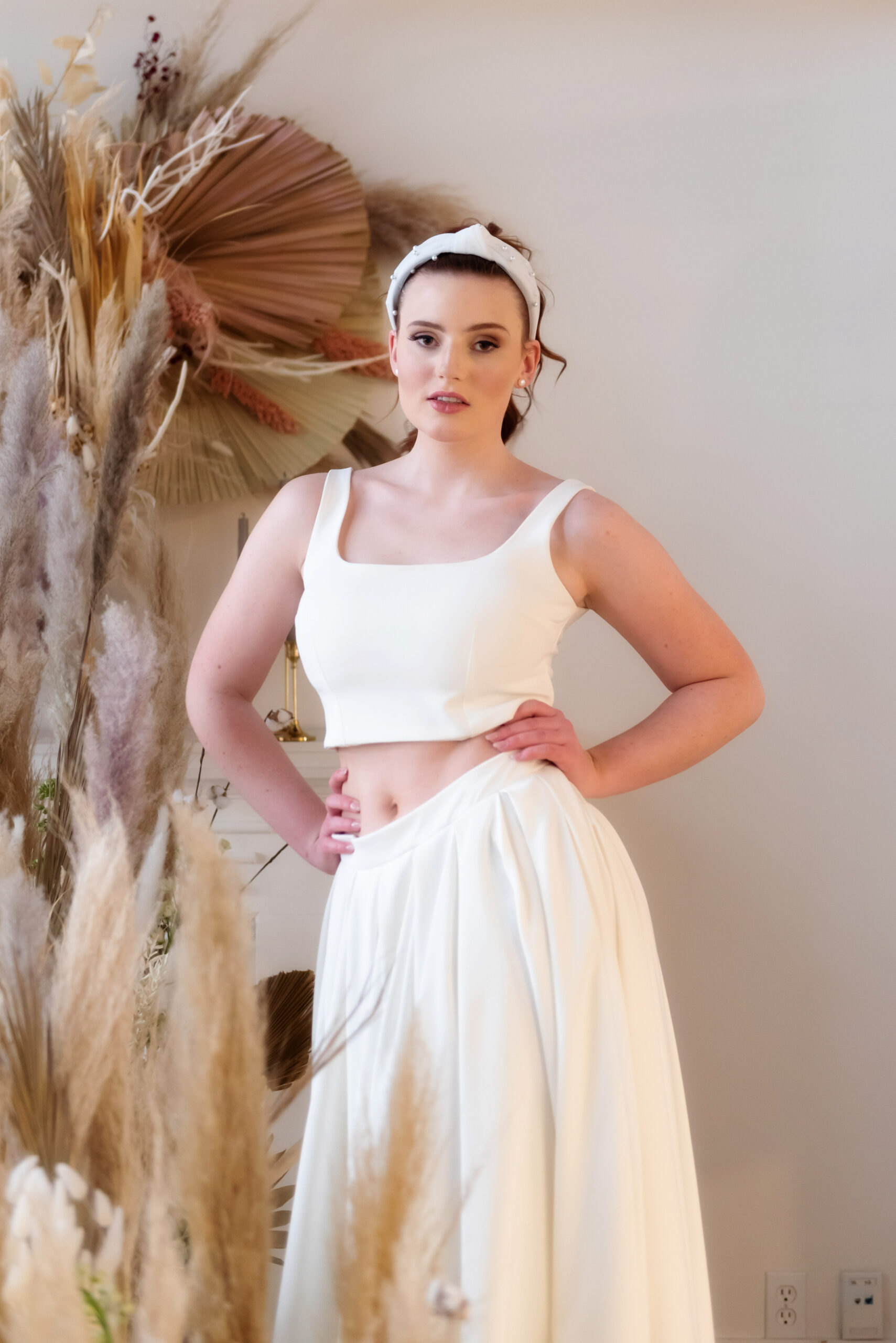 Bride in youthful, two piece wedding gown with head band
