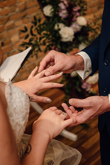 Bride and Groom exchanging wedding rings