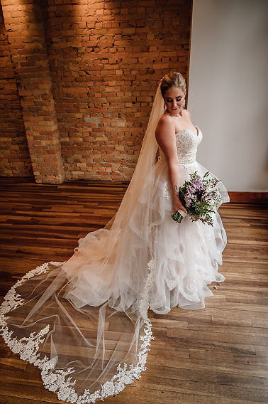 Bride in classic wedding ballgown with cathedral veil