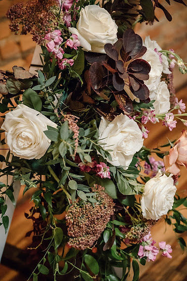 Modern wedding flowers with blush, ivory and dark burgundy flowers