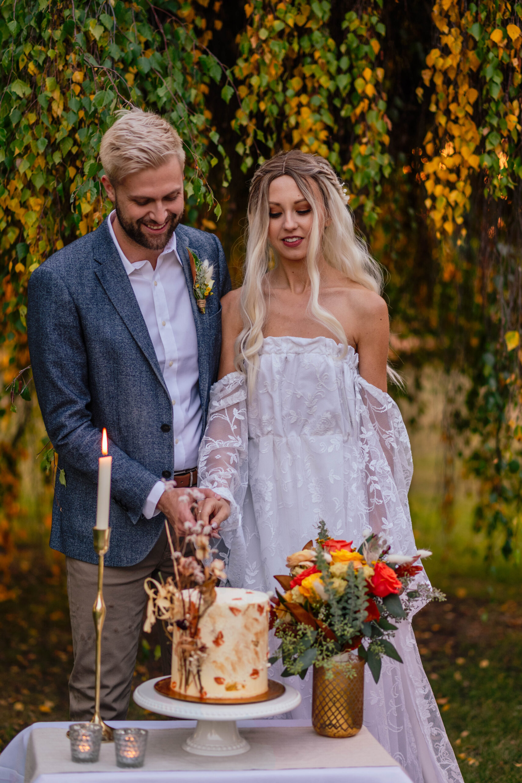 Bride and groom cutting the wedding cake