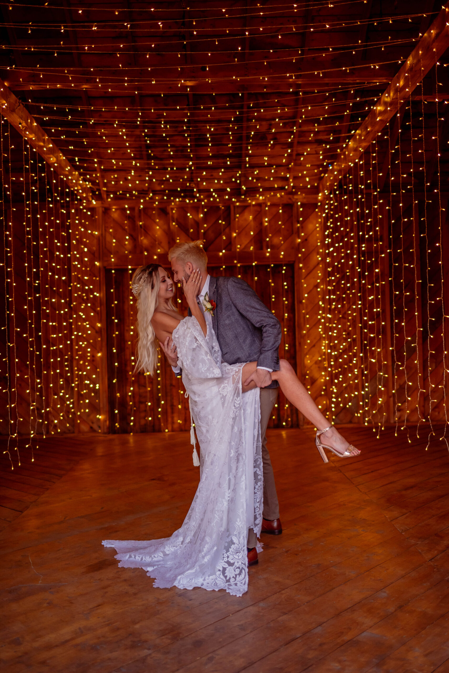 Bridge and Groom dancing with twinkle lights